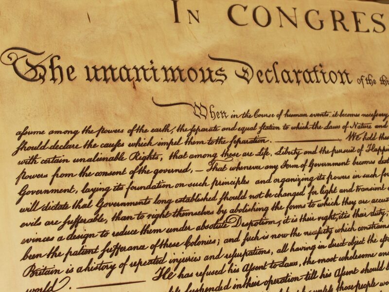 The opening lines of the Declaration carved in maple