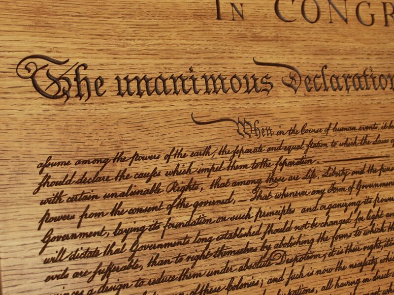 The opening lines of the Declaration carved in rift white oak